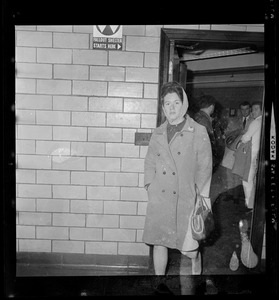 A woman exits the Maurice Tobin Memorial Building