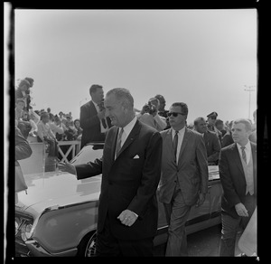President Johnson waves to fans who greet him at the Worcester Airport