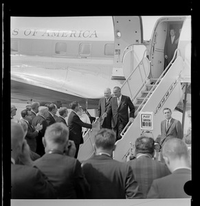 President Johnson deplaning Air Force One and greeted by Governor Peabody