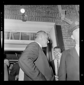 President Johnson walking out of N.E. Baptist Hospital after visiting Senator Ted Kennedy