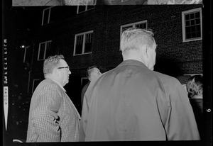 Men waiting outside of N.E. Baptist Hospital for President Johnson