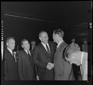 President Johnson shakes Governor Peabody's hand in a group of people