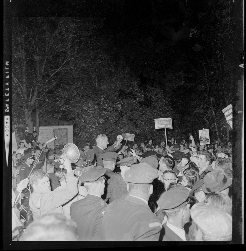 President Johnson amid a throng of supporters