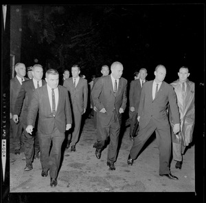 President Johnson walking with his entourage