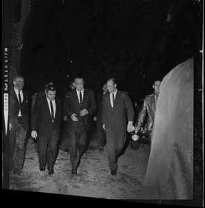 President Johnson walking with his entourage