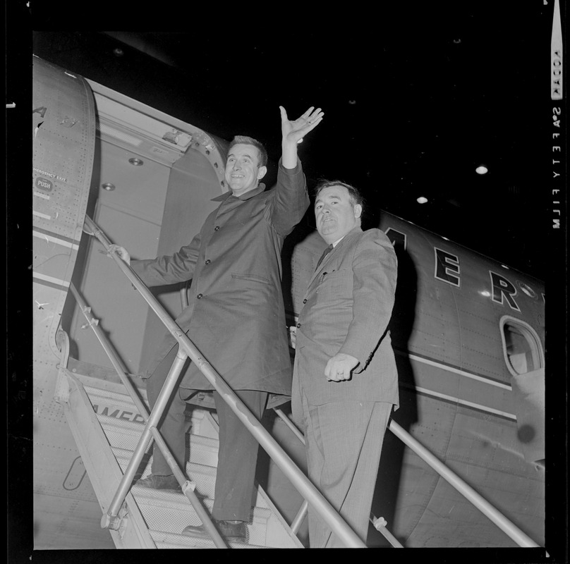 Two men boarding an American Airlines flight