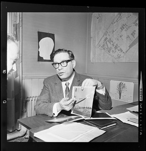 Fiction writer Dr. Isaac Asimov pointing something out on a visual