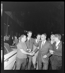 Lt. Gov. Bellotti shaking hands while walking along the road