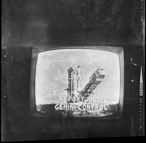 Scene with a report from Gemini Control seen on television screen