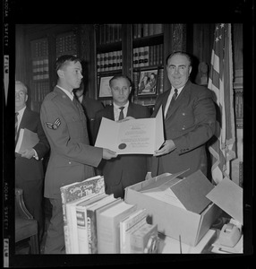 Massachusetts Secretary of the Commonwealth, John F. X. Davoren and another man giving Secretary's Citation award to a wounded Vietnam veteran