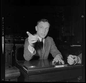 Representative H. Thomas Colo, seated, and talking to someone off camera