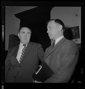 House Speaker John F. X. Davoren looks at Rep. H. Thomas Colo (D-Athol), who brought up a question of ethics, as they leave Speaker's Office in State House