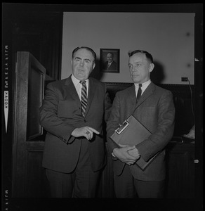 House Speaker John F. X. Davoren looks at Rep. H. Thomas Colo (D-Athol), who brought up a question of ethics, as they leave Speaker's Office in State House