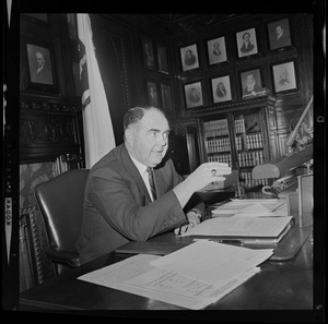 Speaker of the House John Davoren at his desk talking with someone off camera