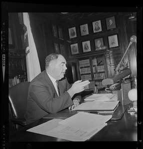 Speaker of the House John Davoren at his desk talking with someone off camera
