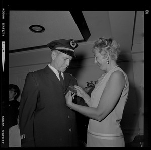 Supt. Oscar T. Dubois and his wife admiring his new badge