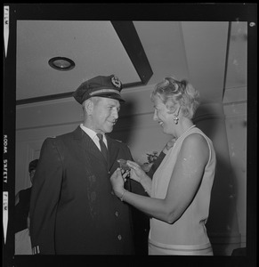 Supt. Oscar T. Dubois and his wife admiring his new badge