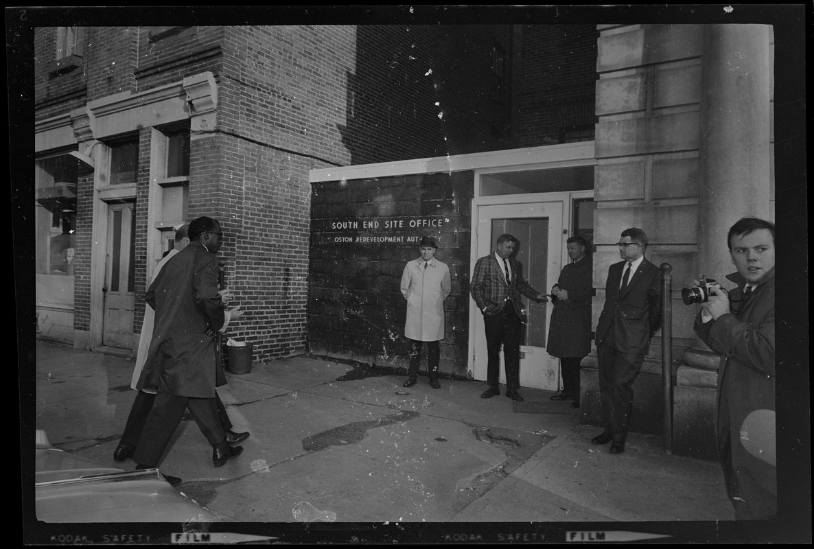 Group of people walking to the South End Site Office of the Boston Redevelopment Authority