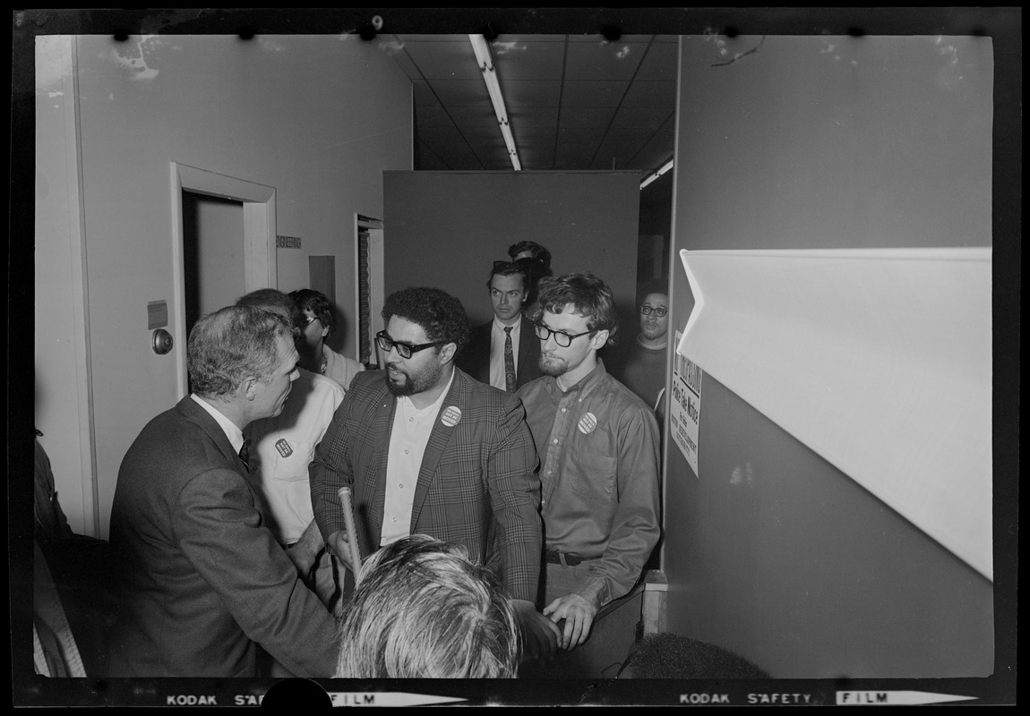 Mayor White speaking with two other men