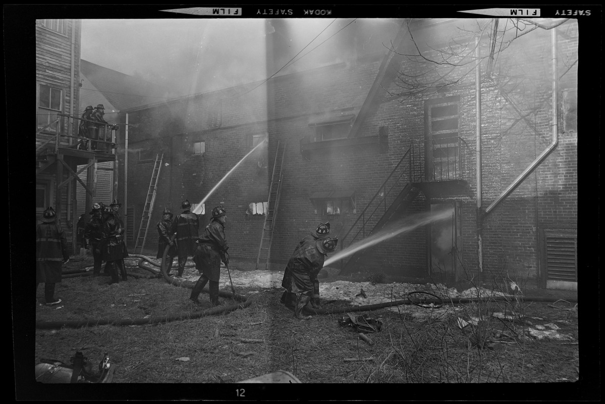 Firefighters with hoses working on putting out the large-scale fire from Blinstrub's Village nightclub