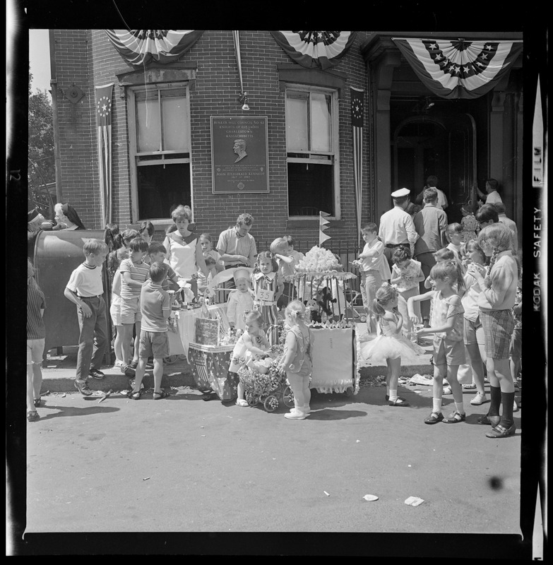 Group of children on the sidewalk waiting for the parade