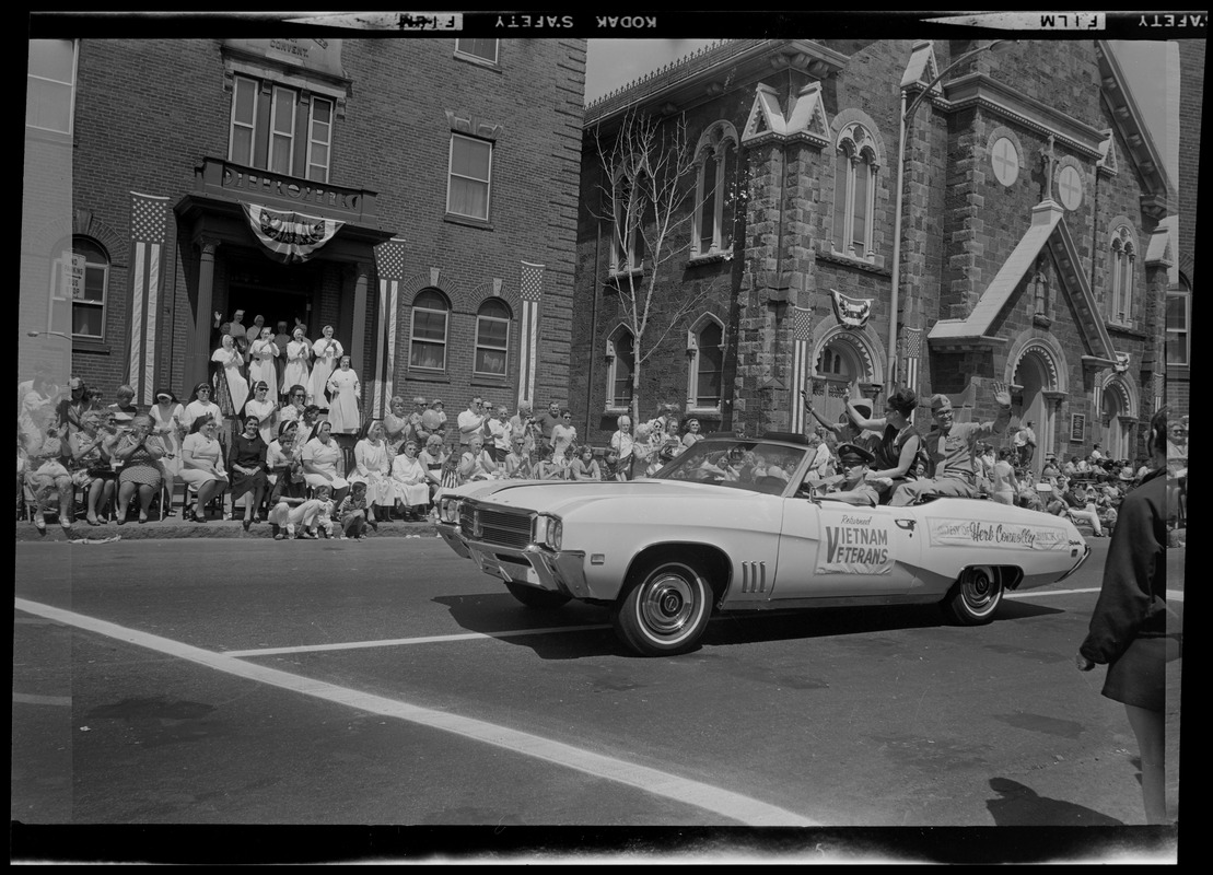 Vietnam Veterans convertible going by the St. Francis de Sales Convent