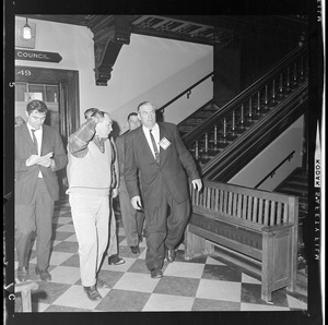 Man, most likely a city official, after coming down the stairs for a Boston Redevelopment Authority hearing