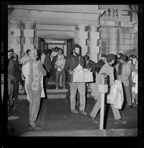 Black Boston University students carry provisions out of BU Administration Building as their 12-hour sit-in in the building ends