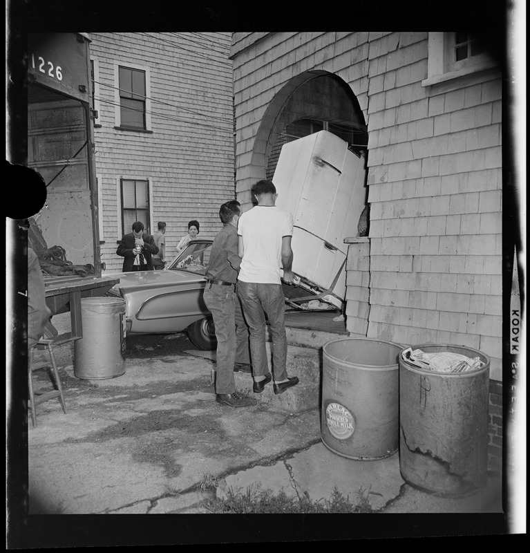 Men carrying a refrigerator Digital Commonwealth