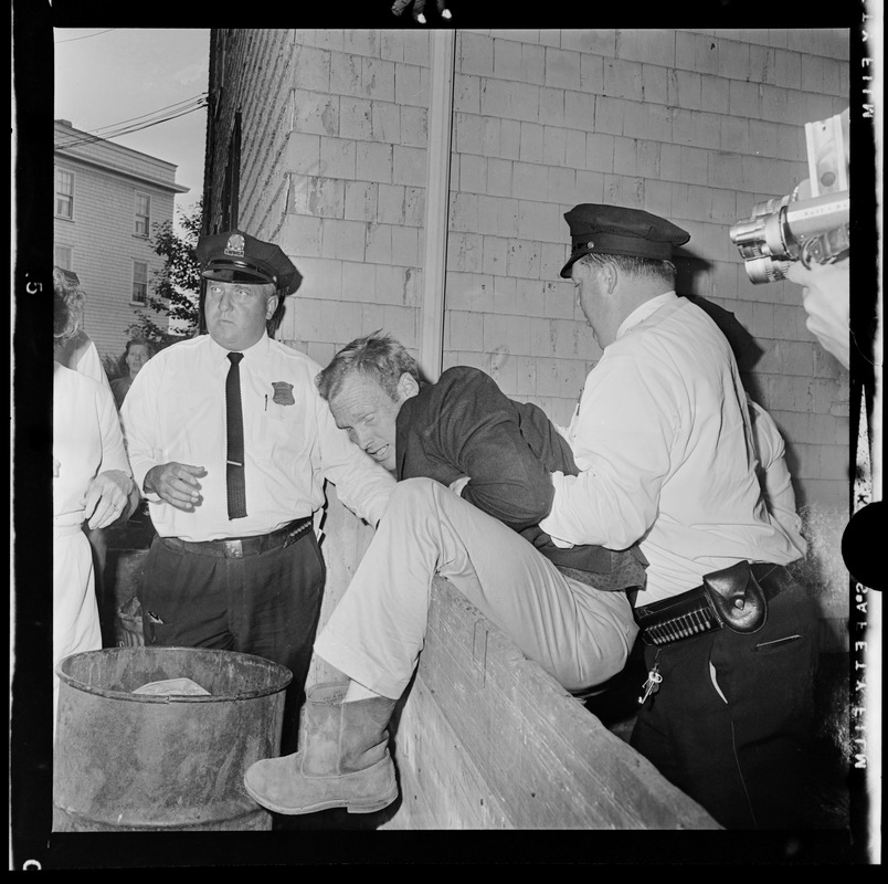 Residents in a scuffle with police officers