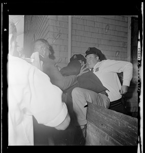 Resident in a scuffle with police officers