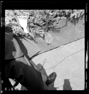 Photo of the ground with a man's shoe and shadow