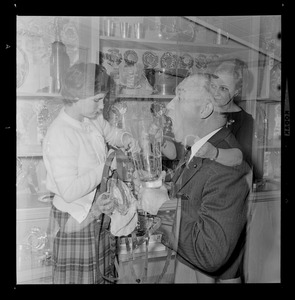 Walter Brown, center, and his daughter Marjorie, left, and his wife Marjorie, right, polishing objects