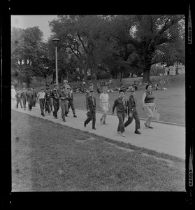 Group of young boy scouts walking on the path through Boston Common
