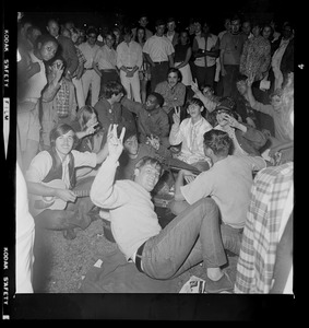 Large seated group on the grass, most likely in Boston Common