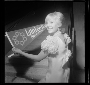 Young woman holding Winterfest pennant