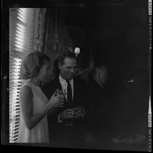 Kathryn and Kevin White holding wine glasses