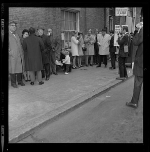 White family wait in line to vote at the Charles Street Meeting House
