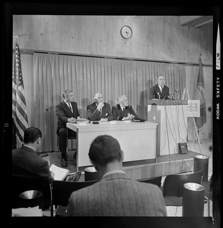 Mayor Kevin White addressing the newsmen as Boston Police officials ...