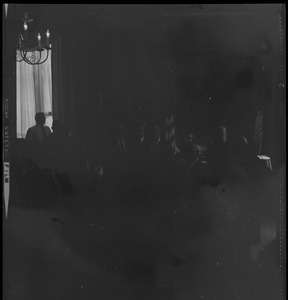 Dark view of Mayor Kevin White meeting with the Dudley Merchants Association at City Hall to hear their problems relating to the Roxbury business community