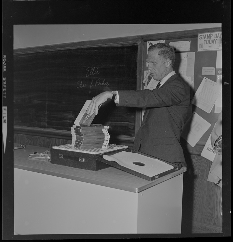 Mayor Kevin White looking at classroom materials