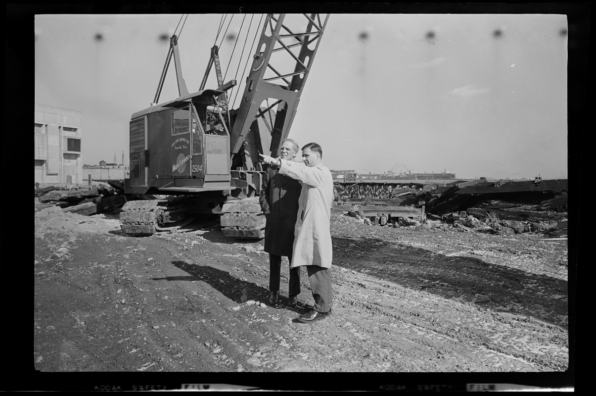 Mayor Kevin White with another man on the construction site at India Wharf