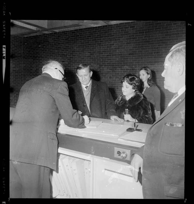 Gov. John A. Volpe and his wife Jennie Volpe checking in at New City Hall to visit Mayor Kevin White