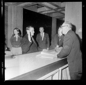 Gov. Volpe taking some sort of oath at the lobby entrance of New City Hall