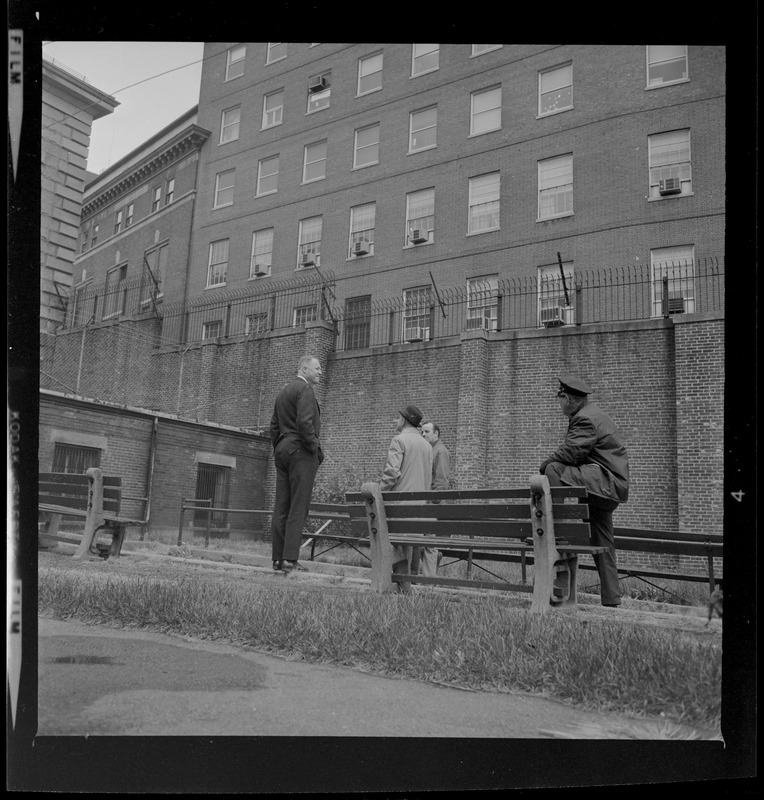 Officers talking near a park bench