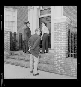 Officers talking outside of an doorway