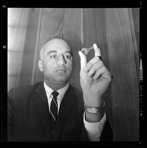 Former Lt. Gov. Francis Bellotti with key he claims fits all locks in new State Building