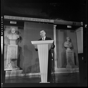 Former Gov. Volpe speaking at the podium during the debate a Lt. Gov. Francis X. Bellotti