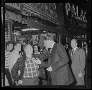 Evangelist Dr. Billy Graham meeting with fans on the streets of Boston