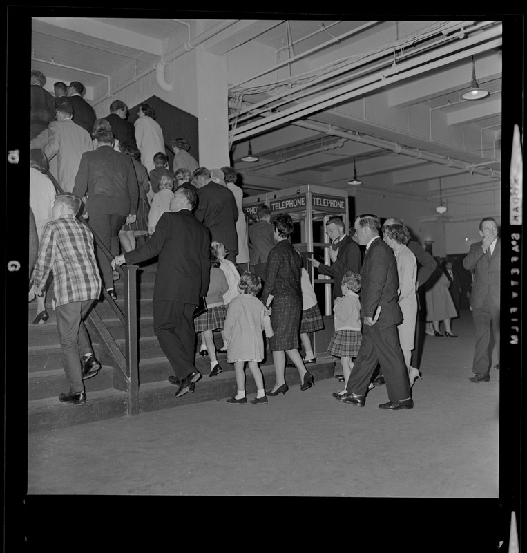 Crowds walking up the stairs of Boston Garden to hear evangelist Dr. Billy Graham